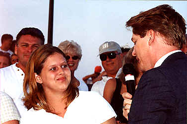 Kevin goes in to the large audience to sing  up close and personal.  